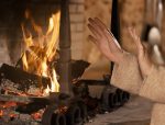 close-up-hands-getting-warm-near-fire